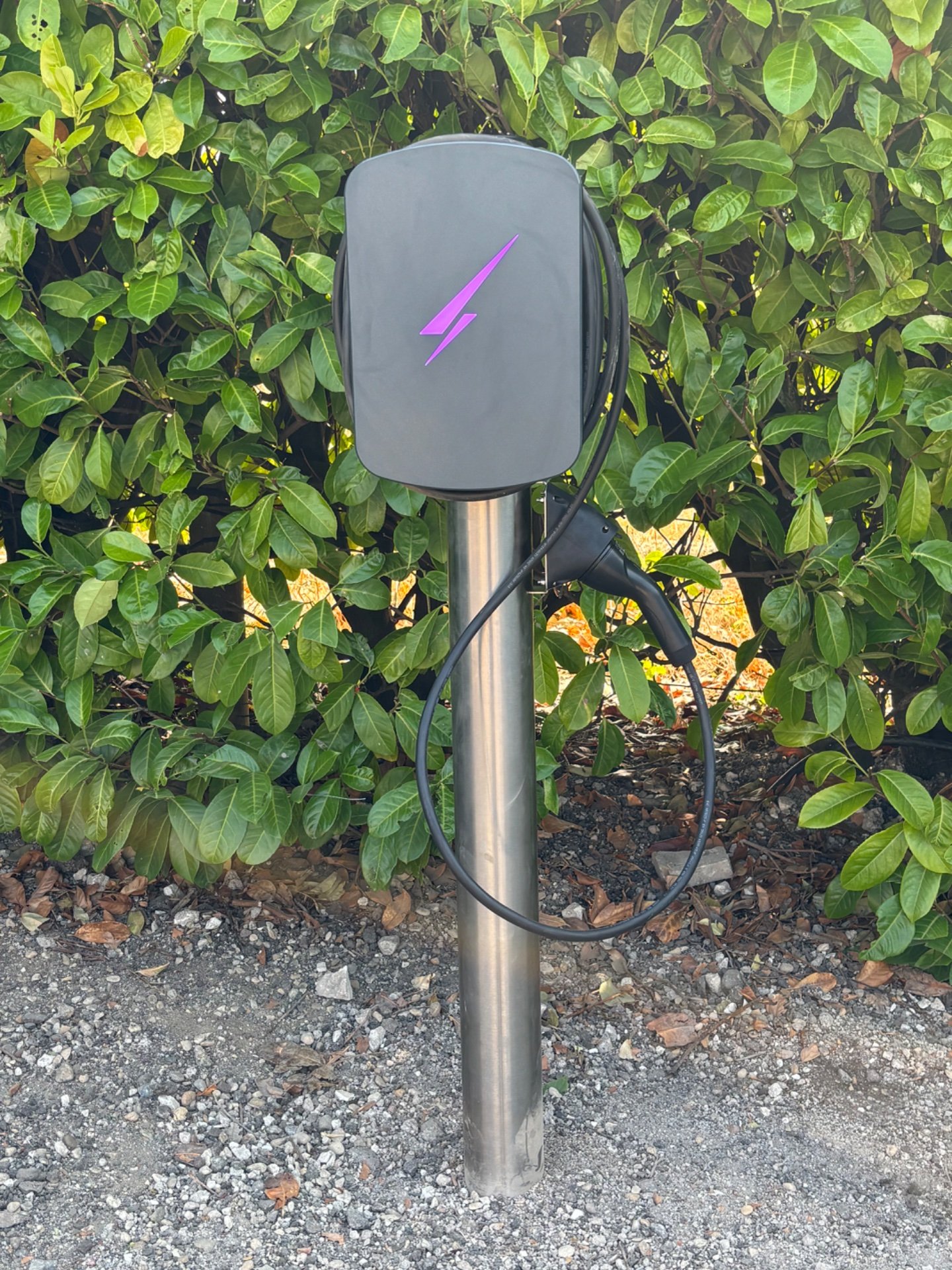 Hypervolt Home 3 Pro EV charger on a stainless steel pedestal mount at the end of a driveway in Princes Risborough, HP27 0DP, with a concrete base foundation visible.